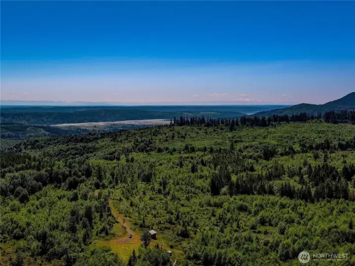 Quilcene and Quilcene Bay are just a few miles away for stores and Hood Canal access. The Cascade Mtn range in the distance can be seen from several sites on the property. Quilcene and Quilcene Bay are just a few miles away for stores and Hood Canal access. The Cascade Mtn range in the distance can be seen from several sites on the property.