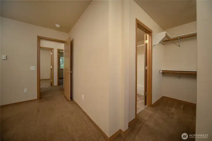 primary bedroom to closet and full bath