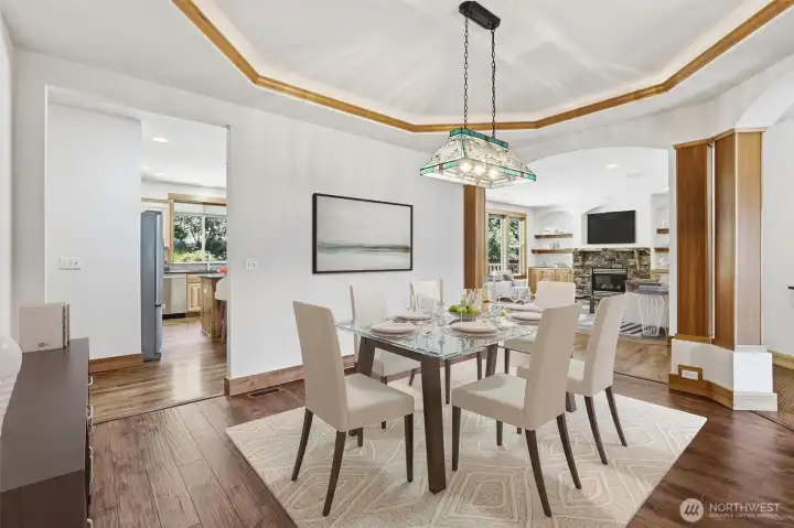 IMPRESSIVE DINING ROOM, GREETS GUESTS FROM ENTRY W/ EASY ACCESS FROM KITCHEN.