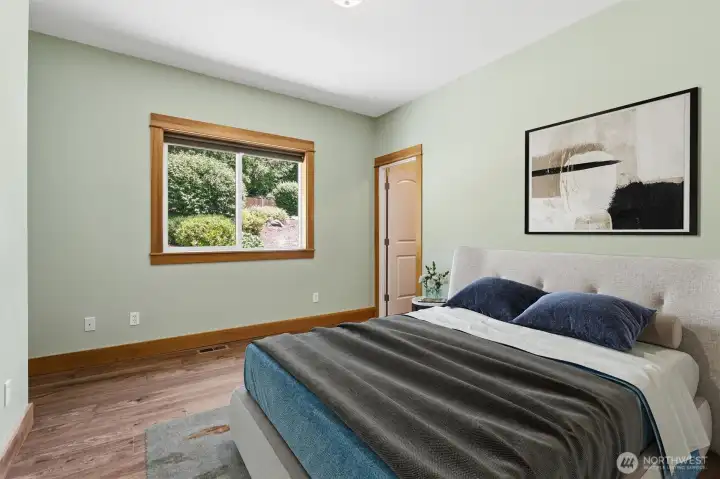 PLEASANT THIRD BEDROOM IS COMFY AND RELAXING W/ PRIVATE BATHROOM ACCESS.