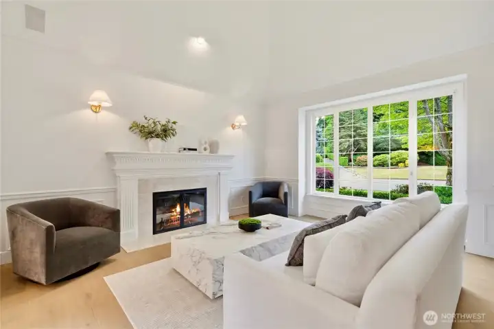 Formal living room with vaulted ceiling & gas fireplace