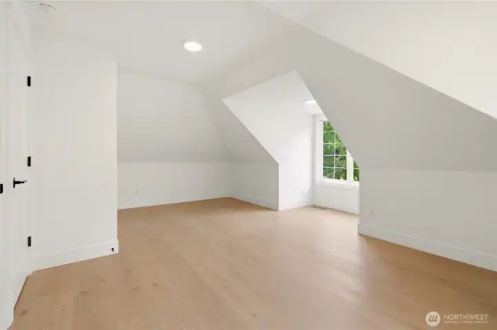 Spacious bonus room above the attached garage, accessed separately from the main living area