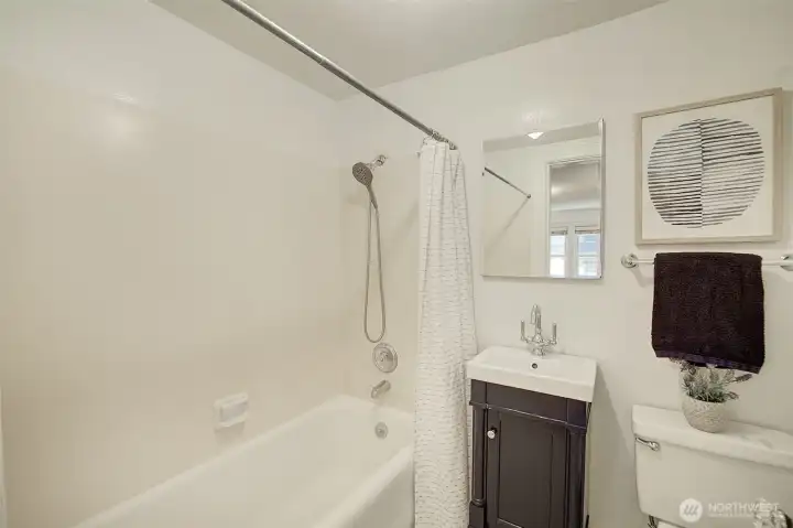 Updated bathroom with marble tiled floor Updated bathroom with marble tiled floor