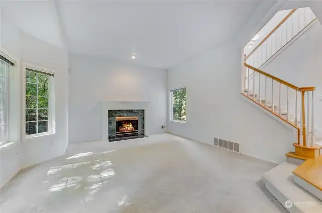 Living Room w/gas fireplace and natural light