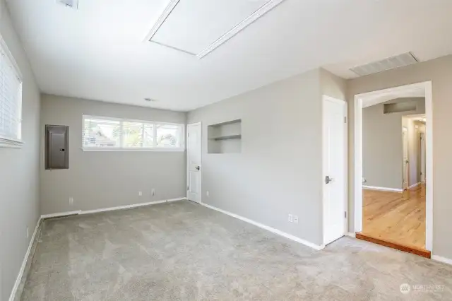 Great Room with closet and shelving entering into the kitchen nook and Family Room