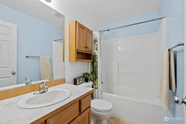 Full bathroom in between the third and fourth bedroom.