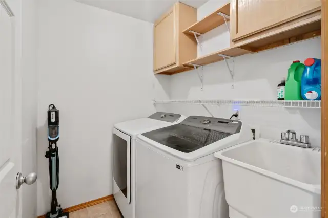 Laundry room across from the full bath in between the third and fourth bedroom.