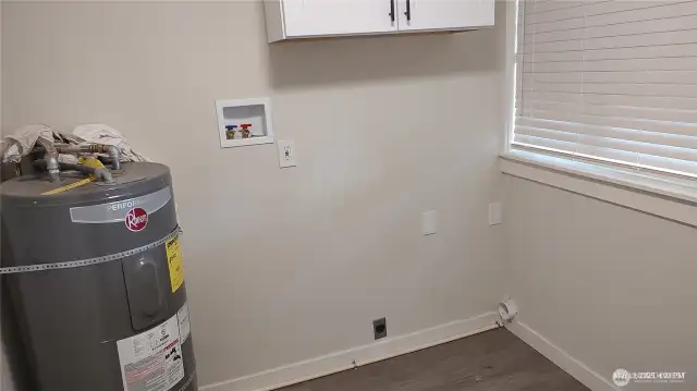 Utility room with washer and dryer hookups.