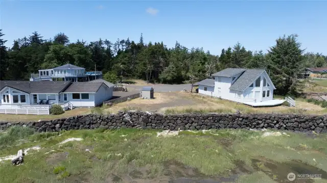 Property is protected by a bulkhead, with a staircase built into the rock wall, leading to the shoreline.