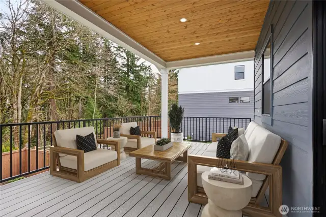 Main floor covered Trex deck overlooks the native growth protected area.