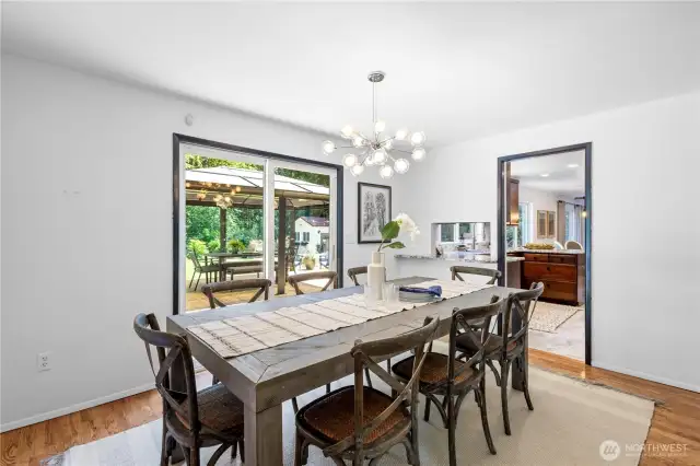Conveniently located off the kitchen, the formal dining room features sliding doors that open to the backyard—an ideal layout for effortless indoor-outdoor entertaining.