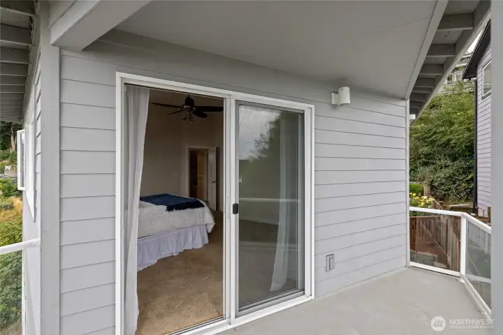 A private covered balcony off the primary bedroom.