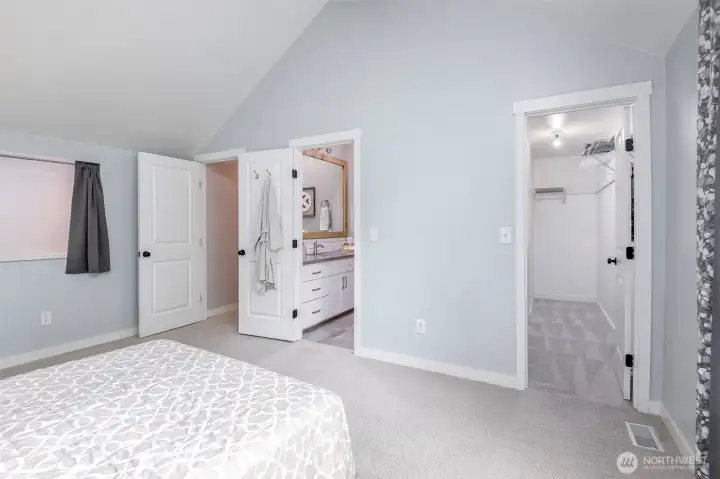 Primary bedroom with view of walk in closet and primary bath
