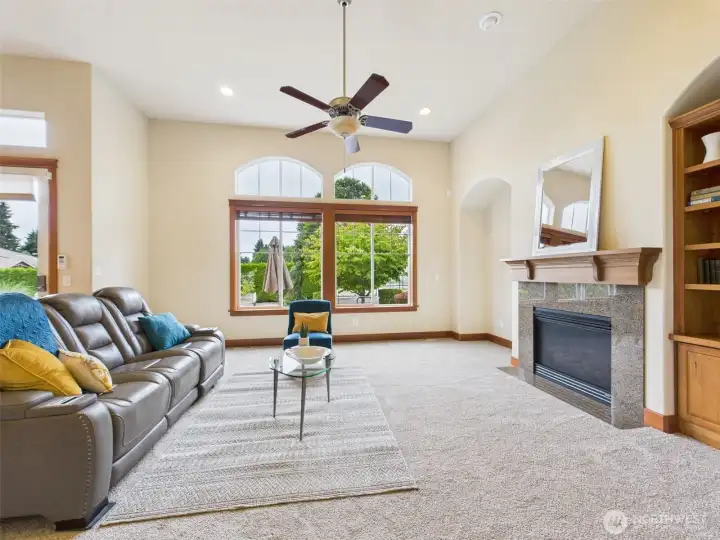 Cozy gas fireplace, tall ceilings, picture windows for plenty of natural light.