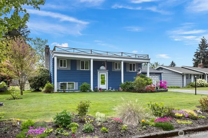 Charming 1960's Colonial split level with beautiful curb appeal.