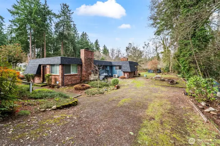 Spanaway Lake duplex on oversized lot with a variety of updates all throughout ownership