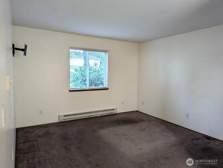 Primary Bedroom...jus t in need of new carpeting or flooring.
