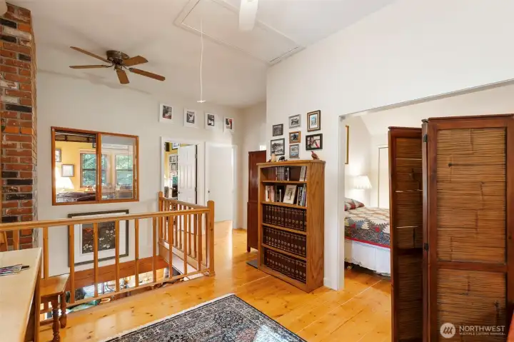 Upstairs loft with primary bedroom to the right
