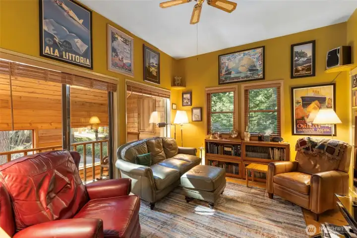 Upstairs bedroom used as a family room--closet is tucked behind the bookcase