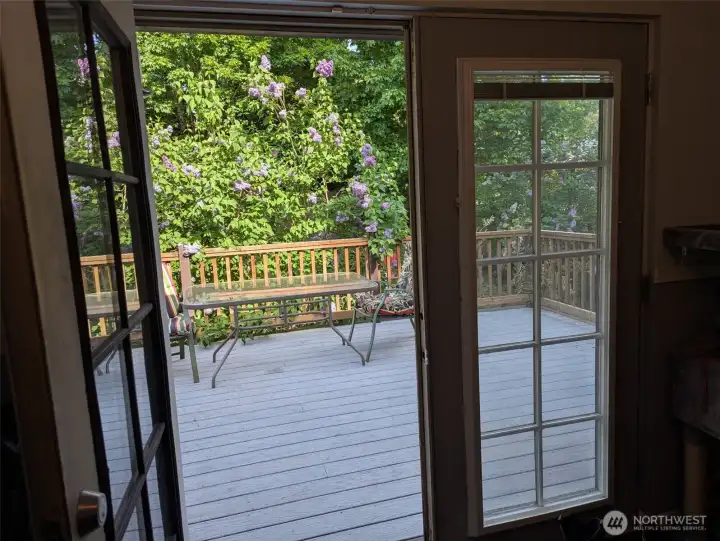 Beautiful French doors off the dining area leading to a large deck Beautiful French doors off the dining area leading to a large deck