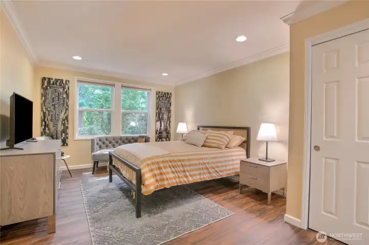 Primary suite with private views, lots of closet space, and pleasant paint palette.