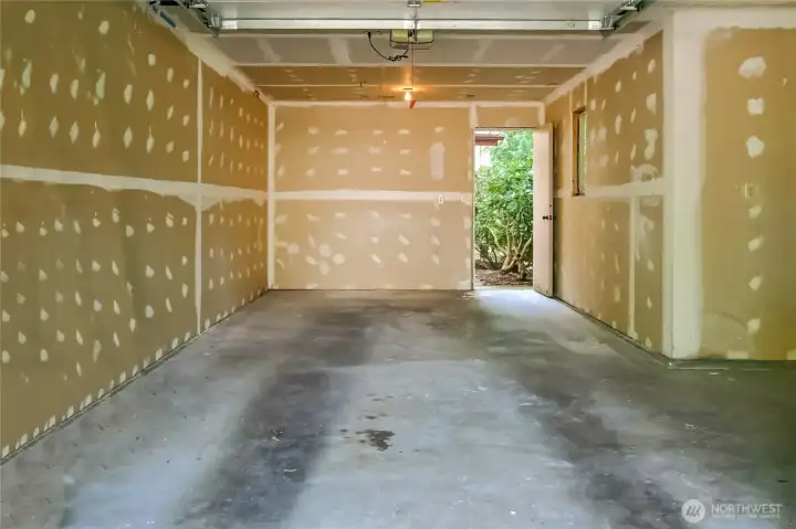 Single car garage has storage space. New garage door opener.