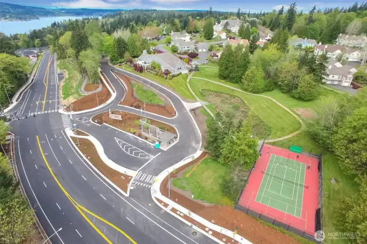 Aerial of community entrance. Sport Court, Clubhouse.