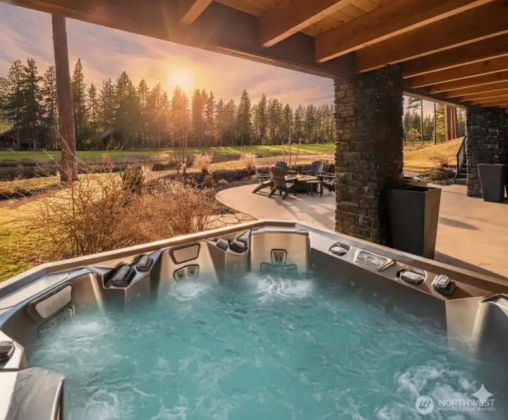 Enjoy a private hot tub with serene sunset views