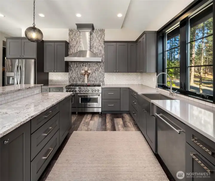 The chef's kitchen is spacious and equipped with everything for ultimate entertaining!