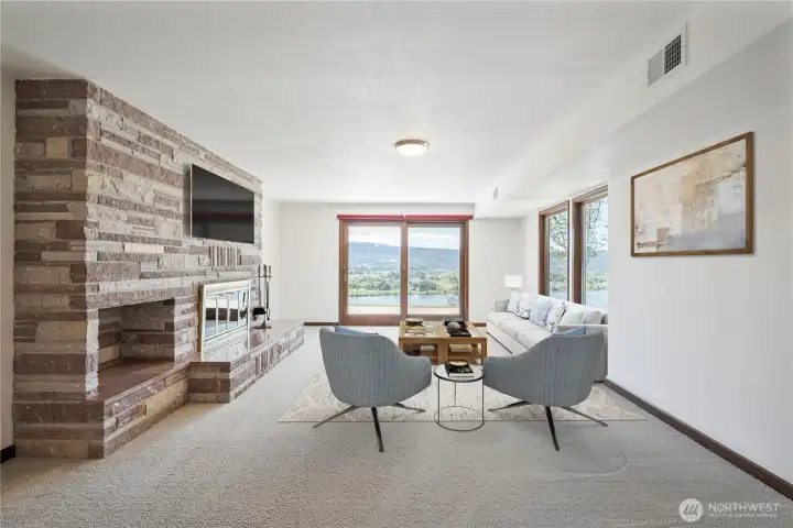 Bonus living space on the lower level with wood burning fireplace and access to the beautiful grounds with river views.
