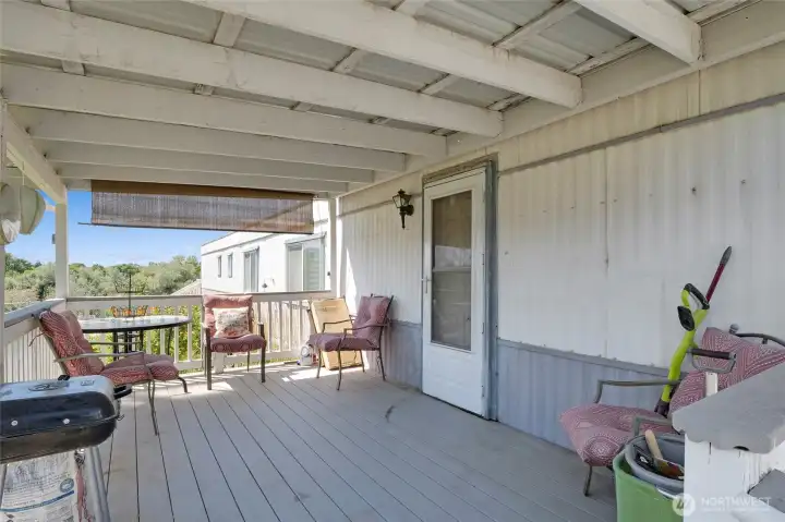 What a cozy front porch with Trex decking! The patio table and chairs stay with the property for your enjoyment! What a cozy front porch with Trex decking! The patio table and chairs stay with the property for your enjoyment!