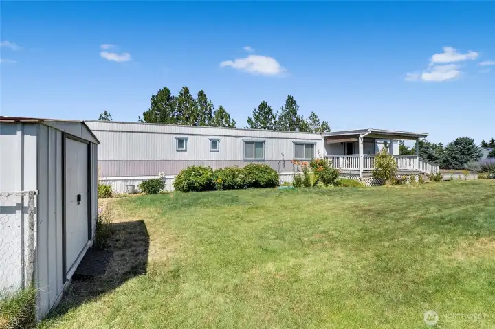 In this 55+ park, there's plenty of lawn for your loved ones to come over and play or have a BBQ! The large shed stays with the property. There's also a smaller shed behind the big one. In this 55+ park, there's plenty of lawn for your loved ones to come over and play or have a BBQ! The large shed stays with the property. There's also a smaller shed behind the big one.