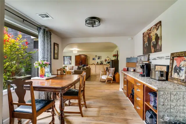 The light-filled dining room sits between the kitchen and living room.