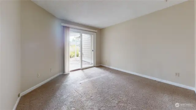 Primary Bedroom with a walk-out sliding glass door to a private  patio