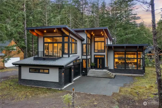 Three car garage attached to home.  Wired for generator with room in the electrical panel to add an EV charging station.