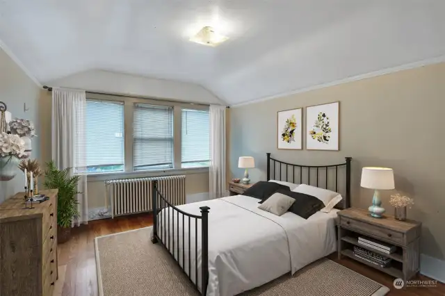 One of two bedrooms on upper level. This photo has been virtually staged.