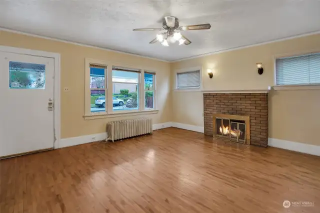 A warm fireplace with sconce lighting makes a lovely focal point to the room.