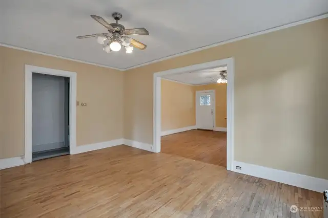 Hardwood floors carry from living room to dining room.