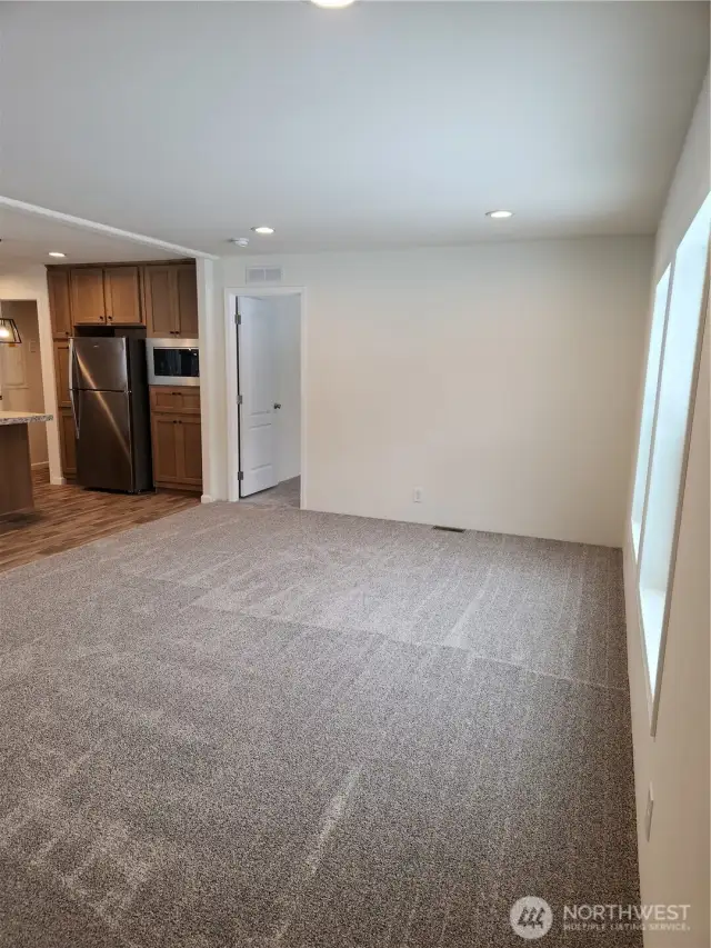 Primary bedroom is purposefully set at the other end of the home away from guest bedrooms to give owners more privacy.  Door to primary is in the photo.