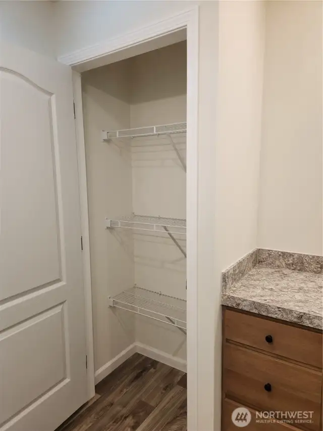 Nice sized closet in the primary bath for towels and extra toiletries.