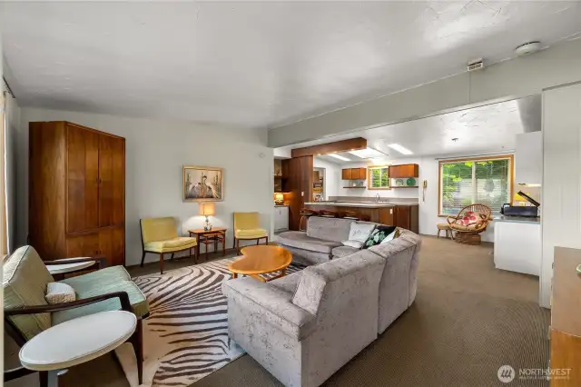 Generously sized living space leads to bonus room and deck while overlooking the water.