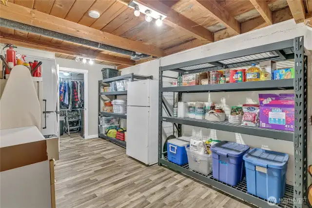 Lots of extra storage. Shelving racks go with seller.