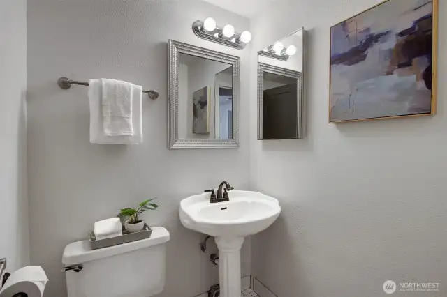 3/4 bathroom with shower tucked away for privacy and convenience.