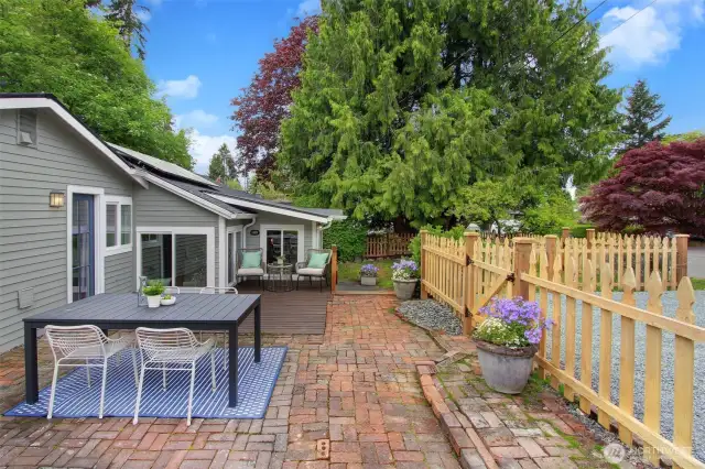 Park in your two-car driveway and step out onto the spacious patio, perfect for hosting large gatherings or enjoying outdoor meals.