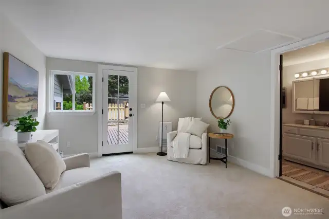 The primary suite feels like a quiet hideaway, with space for a reading nook or morning coffee by the patio door.