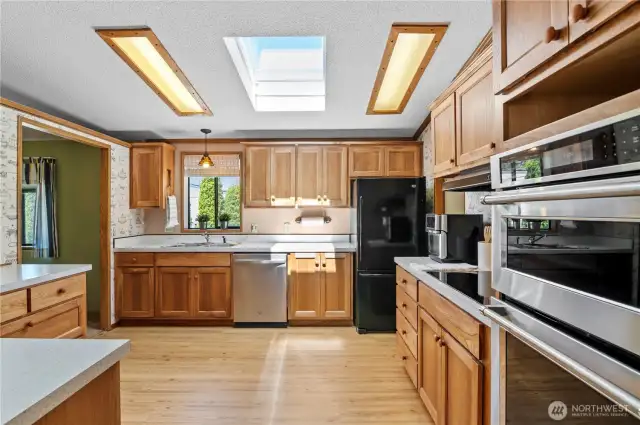 spacious kitchen with hickory cabinets