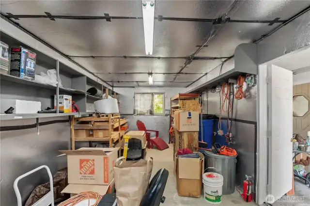 storage room off of garage which could be used for woodworking, crafting, canning...