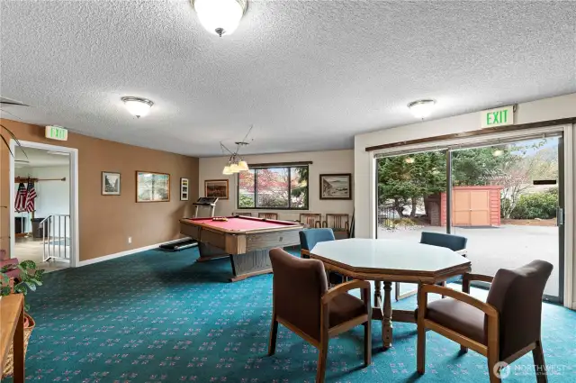 club house with table for cards, games, puzzles and a pool table