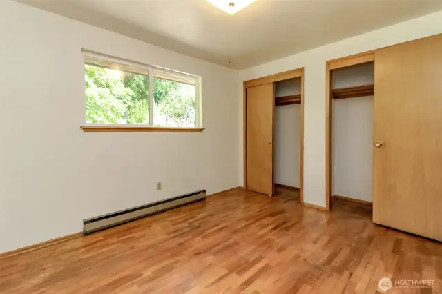 Primary bedroom with double closets.