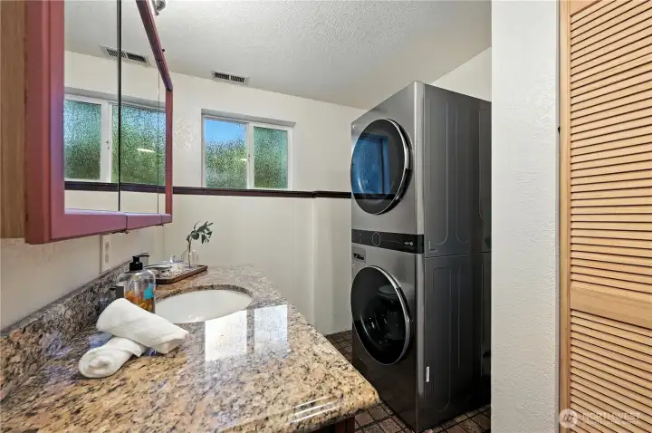 Laundry room with storage.